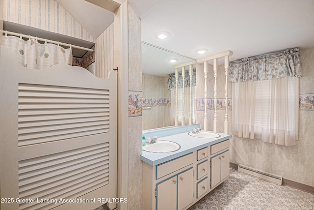 6528 Old River Trl, Lansing, MI 48917 - full bath featuring recessed lighting, double vanity, baseboard heating, and a sink