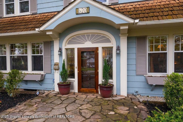 620 Ardson Rd, East Lansing, MI 48823 - doorway to property featuring a chimney