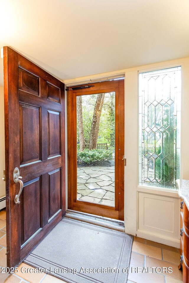 620 Ardson Rd, East Lansing, MI 48823 - entryway with light tile patterned floors