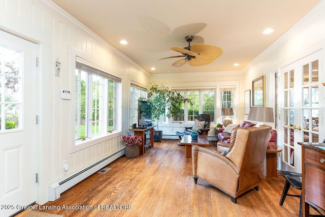 620 Ardson Rd, East Lansing, MI 48823 - sunroom with french doors, a baseboard heating unit, wood finished floors, ornamental molding, and recessed lighting