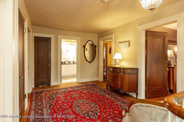 620 Ardson Rd, East Lansing, MI 48823 - foyer entrance with wood finished floors and baseboards