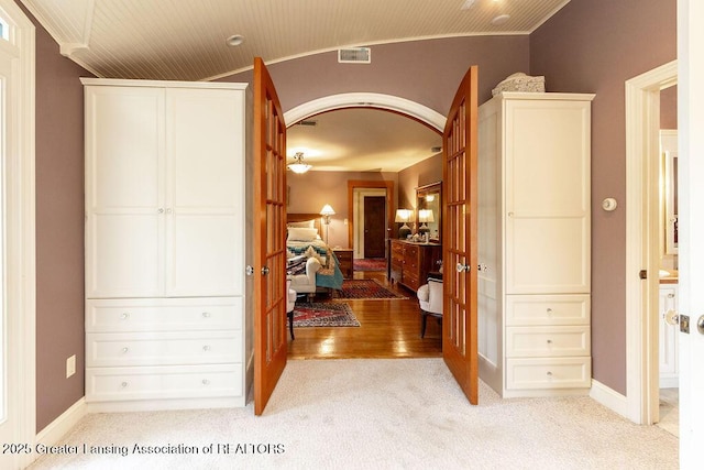 620 Ardson Rd, East Lansing, MI 48823 - hall featuring light colored carpet, ornamental molding, and baseboards