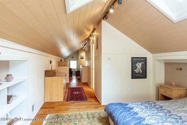 620 Ardson Rd, East Lansing, MI 48823 - bedroom with track lighting, light wood-type flooring, lofted ceiling, a skylight, and wooden ceiling