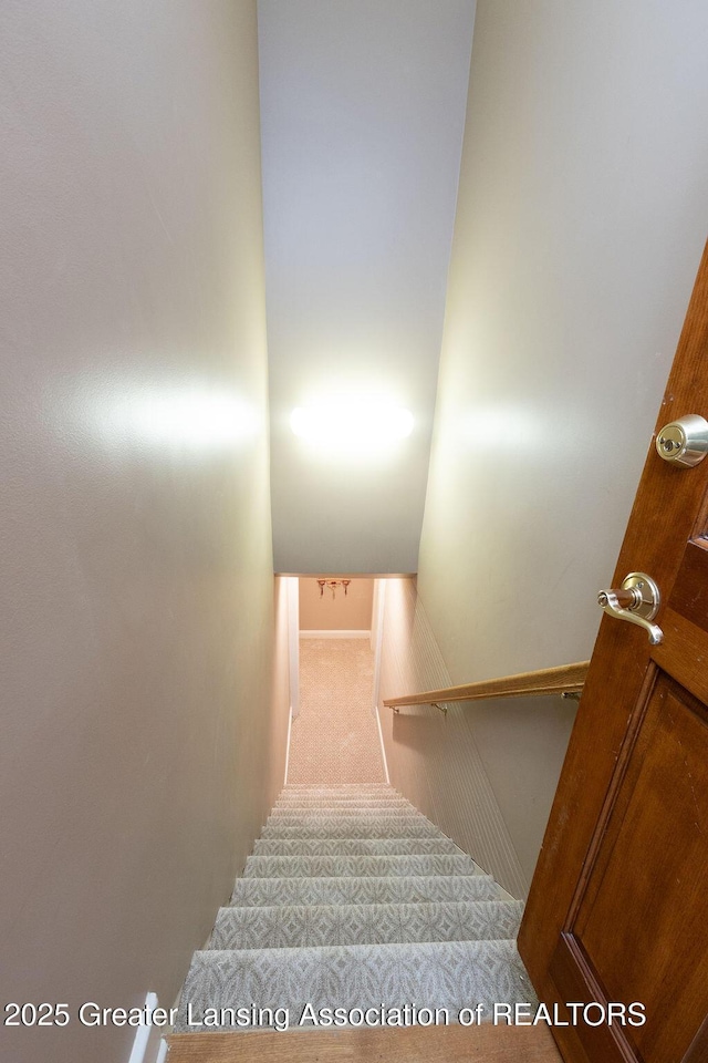 620 Ardson Rd, East Lansing, MI 48823 - staircase with carpet and baseboards
