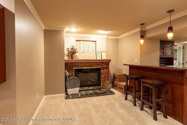 620 Ardson Rd, East Lansing, MI 48823 - indoor dry bar featuring crown molding, carpet, a glass covered fireplace, hanging light fixtures, and baseboards