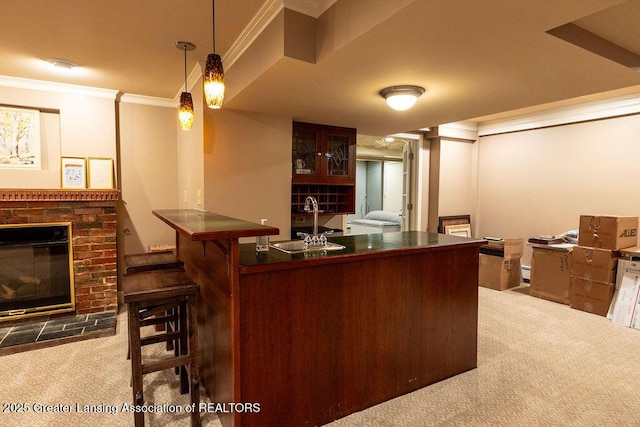 620 Ardson Rd, East Lansing, MI 48823 - indoor bar featuring carpet floors, ornamental molding, a fireplace, and hanging light fixtures