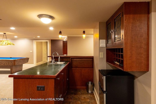 620 Ardson Rd, East Lansing, MI 48823 - kitchen featuring a sink, dark countertops, refrigerator, baseboards, and recessed lighting