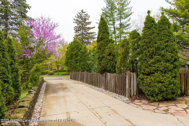 620 Ardson Rd, East Lansing, MI 48823 - view of patio with fence and concrete driveway