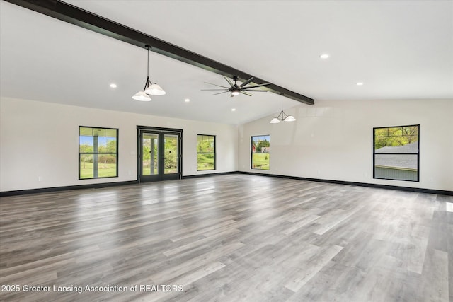1551 E Lovejoy Rd, Perry, MI 48872 - unfurnished living room featuring baseboards, healthy amount of natural light, ceiling fan, wood finished floors, and recessed lighting