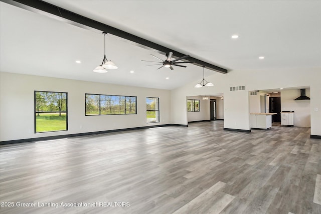 1551 E Lovejoy Rd, Perry, MI 48872 - unfurnished living room featuring light wood-style flooring, baseboards, ceiling fan, and recessed lighting