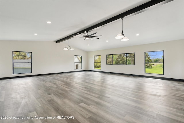 1551 E Lovejoy Rd, Perry, MI 48872 - unfurnished living room with baseboards, wood finished floors, ceiling fan, and recessed lighting