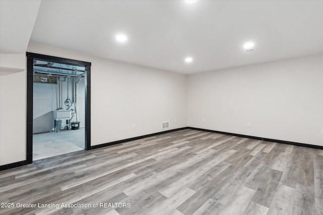 1551 E Lovejoy Rd, Perry, MI 48872 - finished basement with wood finished floors, baseboards, and recessed lighting