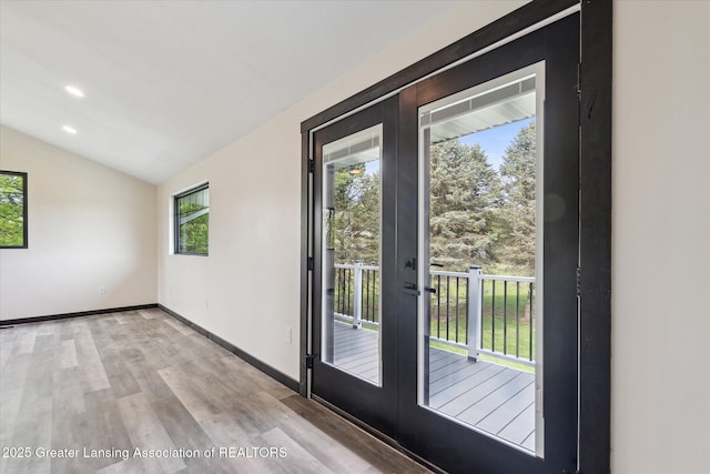 1551 E Lovejoy Rd, Perry, MI 48872 - entryway featuring french doors, light wood-type flooring, vaulted ceiling, baseboards, and recessed lighting