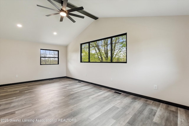 1551 E Lovejoy Rd, Perry, MI 48872 - empty room with beamed ceiling, ceiling fan, baseboards, wood finished floors, and recessed lighting