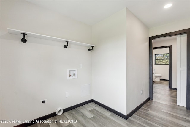 1551 E Lovejoy Rd, Perry, MI 48872 - laundry room featuring light wood-style floors, hookup for an electric dryer, hookup for a washing machine, baseboards, and recessed lighting