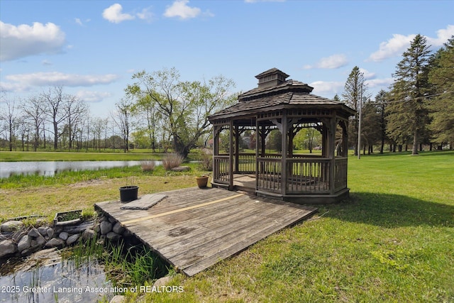 1551 E Lovejoy Rd, Perry, MI 48872 - wooden deck with a gazebo, a lawn, and a water view