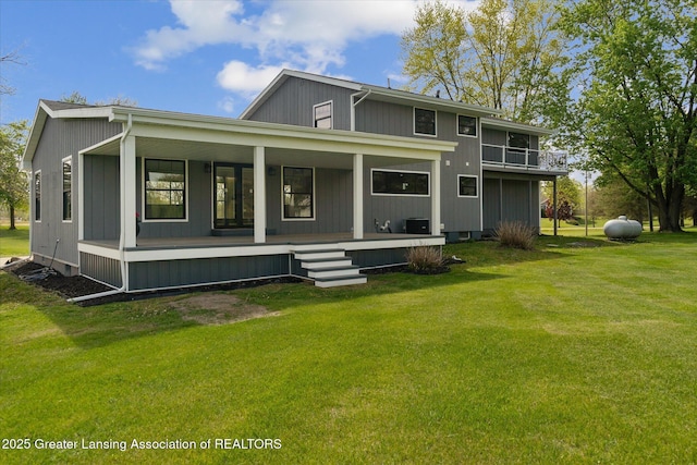 1551 E Lovejoy Rd, Perry, MI 48872 - back of property featuring a yard, a porch, and central AC unit