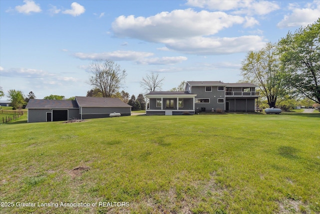 1551 E Lovejoy Rd, Perry, MI 48872 - rear view of property featuring a lawn and a sunroom