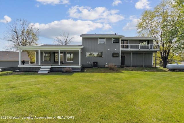 1551 E Lovejoy Rd, Perry, MI 48872 - back of house featuring a porch and a yard