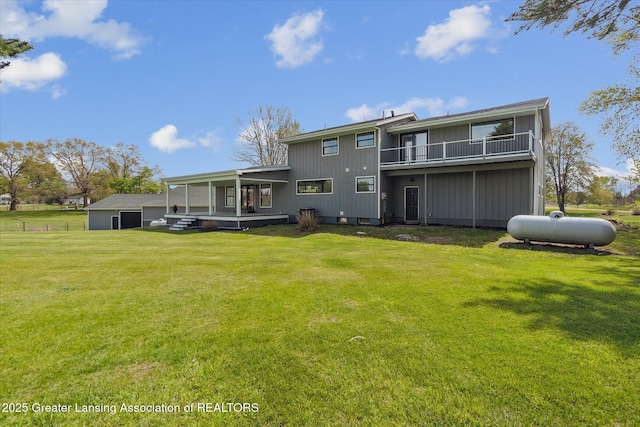 1551 E Lovejoy Rd, Perry, MI 48872 - back of house featuring a lawn