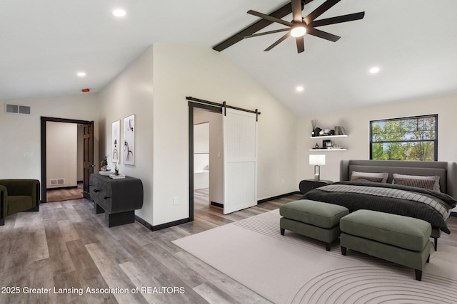 1551 E Lovejoy Rd, Perry, MI 48872 - bedroom with a barn door, wood finished floors, recessed lighting, and baseboards
