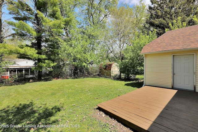 view of yard with a wooden deck