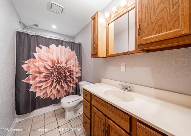 bathroom featuring a shower with curtain, vanity, tile patterned floors, toilet, and visible vents