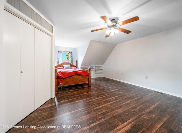 bedroom featuring wood finished floors, visible vents, and baseboards