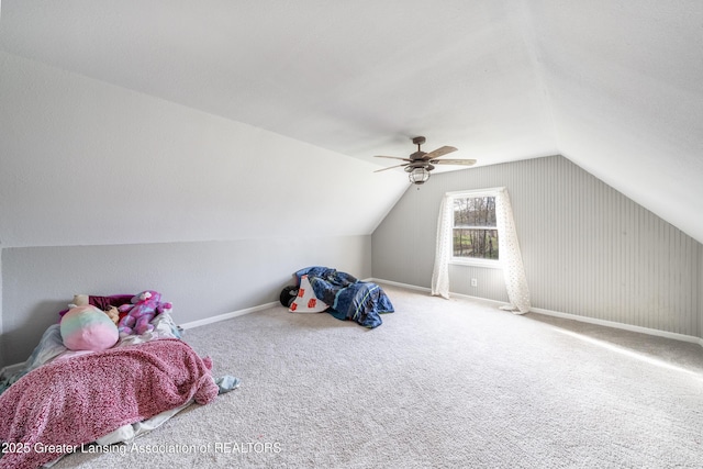 rec room with baseboards, a ceiling fan, carpet flooring, and vaulted ceiling