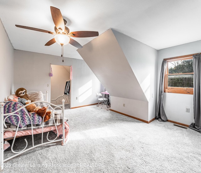 bedroom featuring baseboards, visible vents, a ceiling fan, and carpet