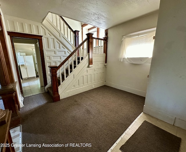 interior space with carpet floors and baseboards