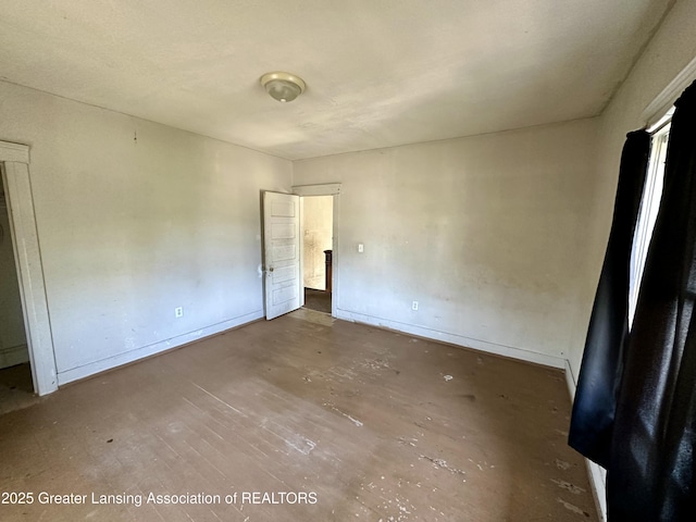 unfurnished bedroom with baseboards