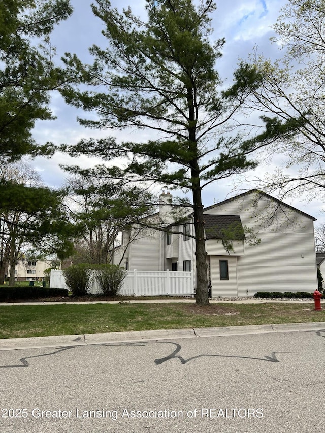 view of front of house with fence