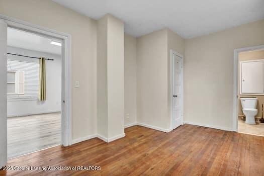1600 S Pennsylvania Ave, Lansing, MI 48910 - spare room featuring wood finished floors and baseboards