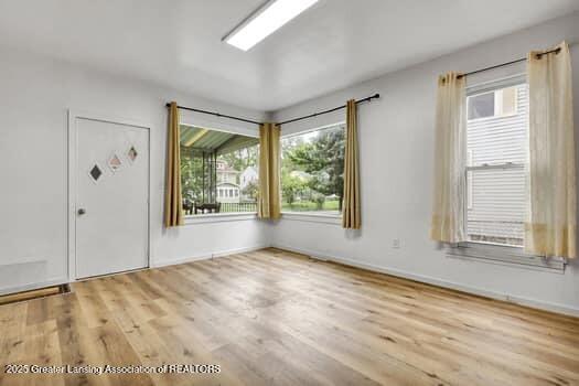 1600 S Pennsylvania Ave, Lansing, MI 48910 - foyer entrance with plenty of natural light, wood finished floors, and baseboards