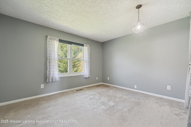 1971 N Michigan Rd, Eaton Rapids, MI 48827 - unfurnished room with carpet flooring, a textured ceiling, visible vents, and baseboards