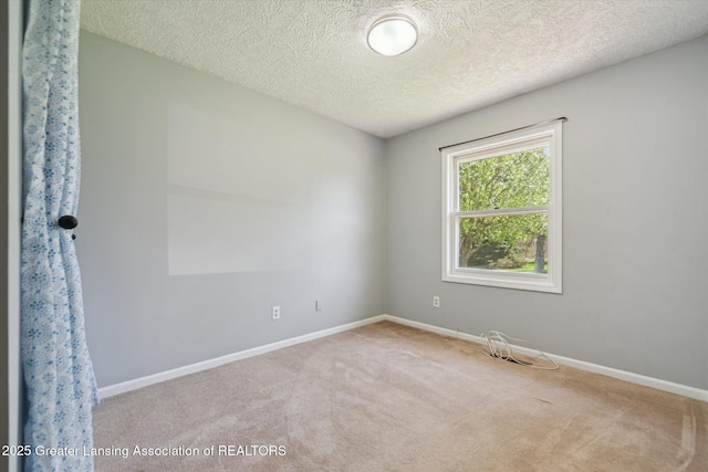 1971 N Michigan Rd, Eaton Rapids, MI 48827 - empty room with carpet floors, a textured ceiling, and baseboards