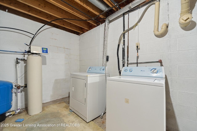 1971 N Michigan Rd, Eaton Rapids, MI 48827 - washroom with concrete block wall, laundry area, and washing machine and clothes dryer