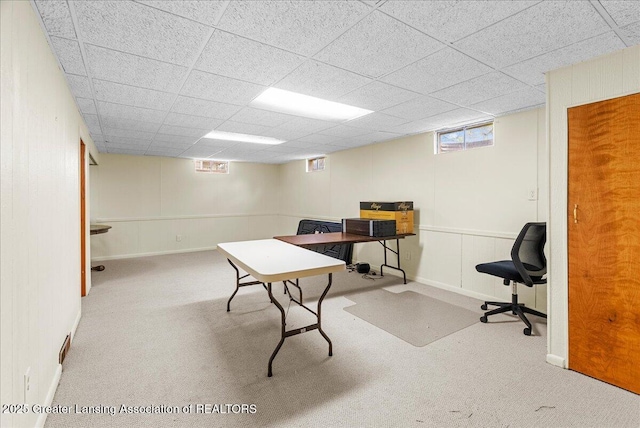 home office with baseboards, carpet, and a drop ceiling