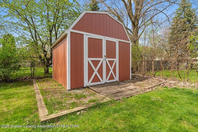 view of shed with fence
