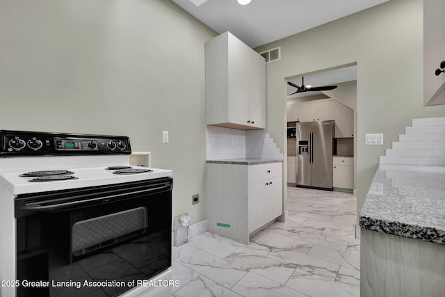 1127 W Saginaw St, Lansing, MI 48915 - kitchen featuring ceiling fan, backsplash, stainless steel refrigerator with ice dispenser, electric range oven, and marble finish floor
