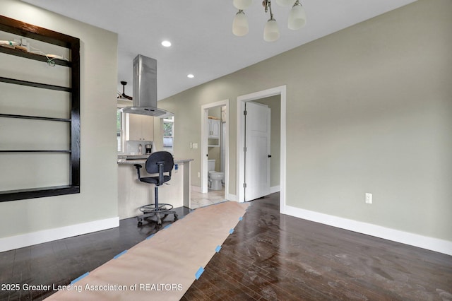1127 W Saginaw St, Lansing, MI 48915 - living area featuring recessed lighting, baseboards, and wood finished floors