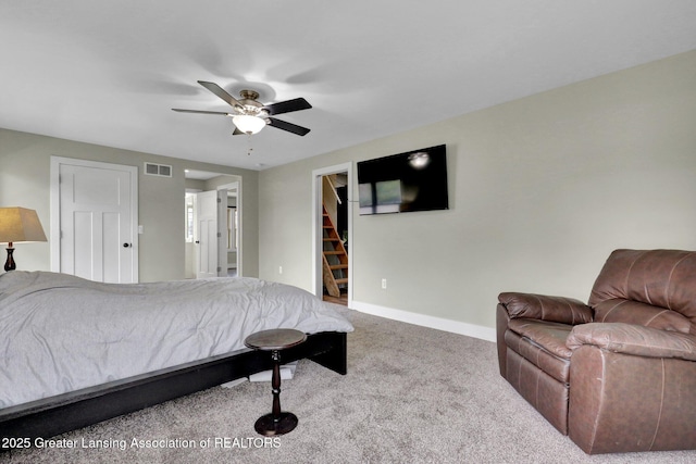 1127 W Saginaw St, Lansing, MI 48915 - bedroom with visible vents, baseboards, a spacious closet, a ceiling fan, and carpet