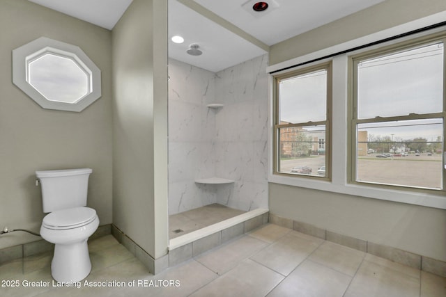 1127 W Saginaw St, Lansing, MI 48915 - full bathroom with tile patterned flooring, a marble finish shower, baseboards, and toilet