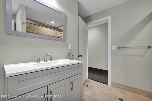 1127 W Saginaw St, Lansing, MI 48915 - bathroom with tile patterned floors, baseboards, and vanity