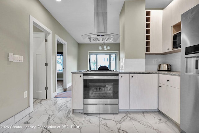 1127 W Saginaw St, Lansing, MI 48915 - kitchen featuring exhaust hood, stainless steel appliances, marble finish floor, and tasteful backsplash