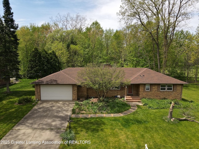 4793 Ottawa Dr, Okemos, MI 48864 - single story home with a garage, concrete driveway, a front lawn, and brick siding