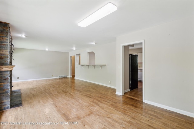 4793 Ottawa Dr, Okemos, MI 48864 - unfurnished living room featuring light wood-style flooring and baseboards