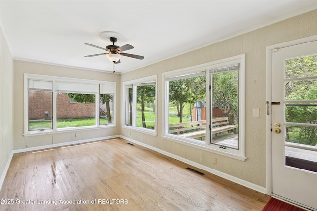 4793 Ottawa Dr, Okemos, MI 48864 - unfurnished sunroom with baseboards, wood finished floors, and ornamental molding