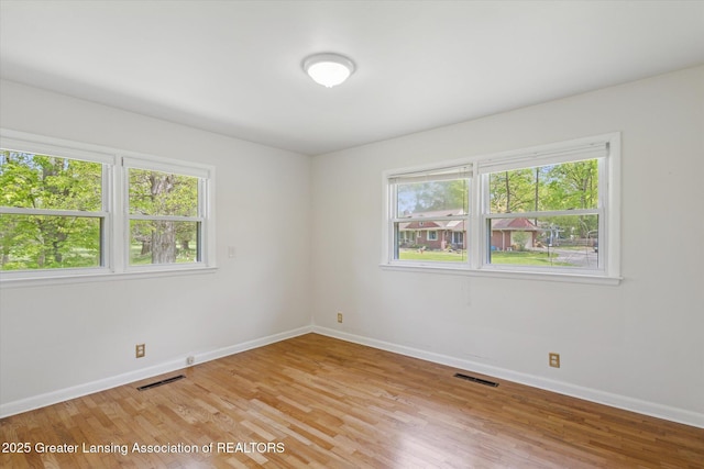 4793 Ottawa Dr, Okemos, MI 48864 - empty room featuring baseboards and light wood finished floors